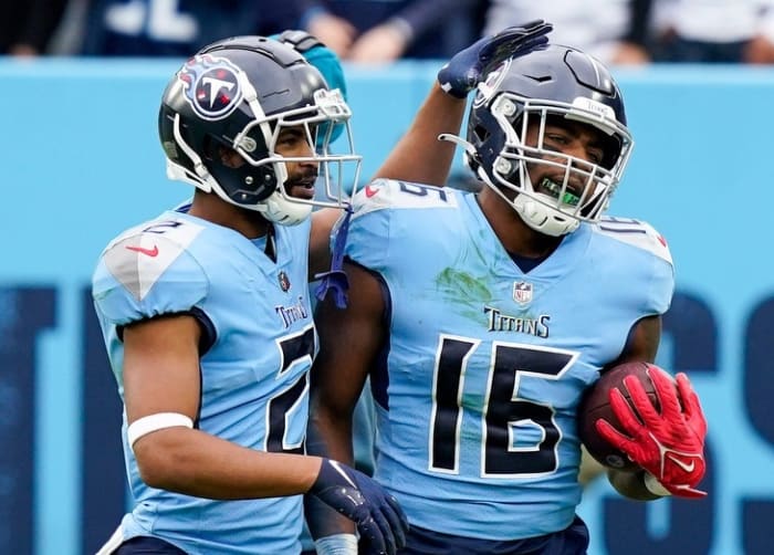 Tennessee Titans wide receiver Treylon Burks (16) is congratulated by wide receiver Robert Woods (2) after he scored a touchdown off a Derrick Henry fumble as they face the Cincinnati Bengals during the second quarter at Nissan Stadium Sunday, Nov. 27, 2022, in Nashville, Tenn.